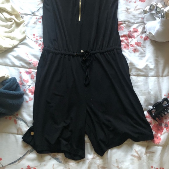 Black romper with gold detailing on the zipper and strings - Picture 2 of 3